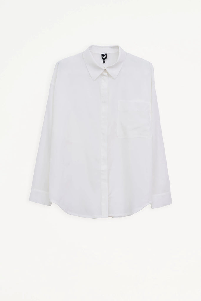 Camisa Mujer Tantä Hazo confeccionada en tejido ligero de secado rápido. Color Blanco 