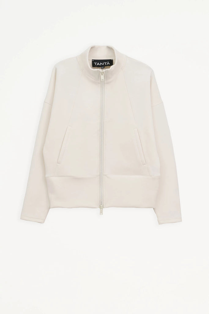 Sudadera de Mujer Tantä con cremallera en tejido interlock secado rápido. Color Blanco roto 