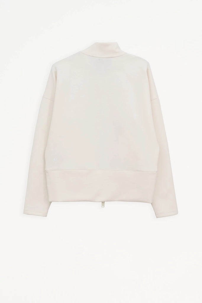 Sudadera de Mujer Tantä con cremallera en tejido interlock secado rápido. Color Blanco roto 