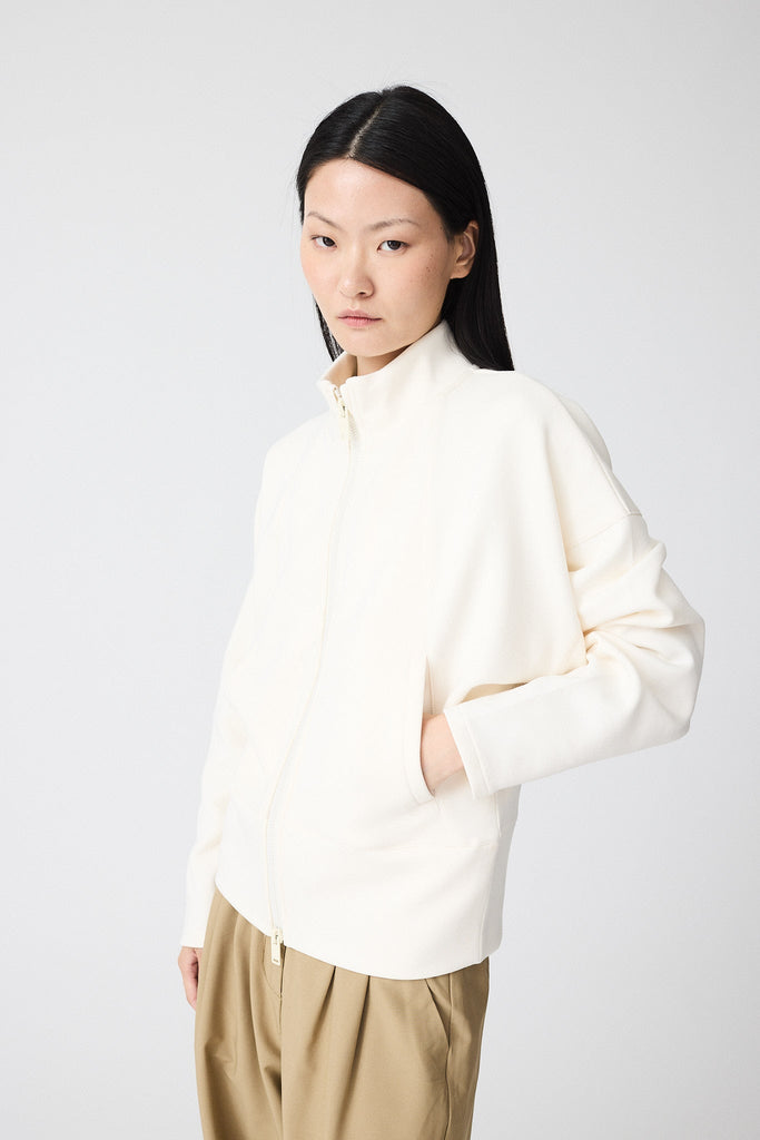 Sudadera de Mujer Tantä con cremallera en tejido interlock secado rápido. Color Blanco roto 