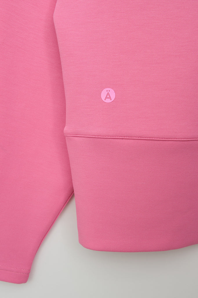 Sudadera de Mujer Tantä con cremallera en tejido interlock secado rápido. Color Rosa 