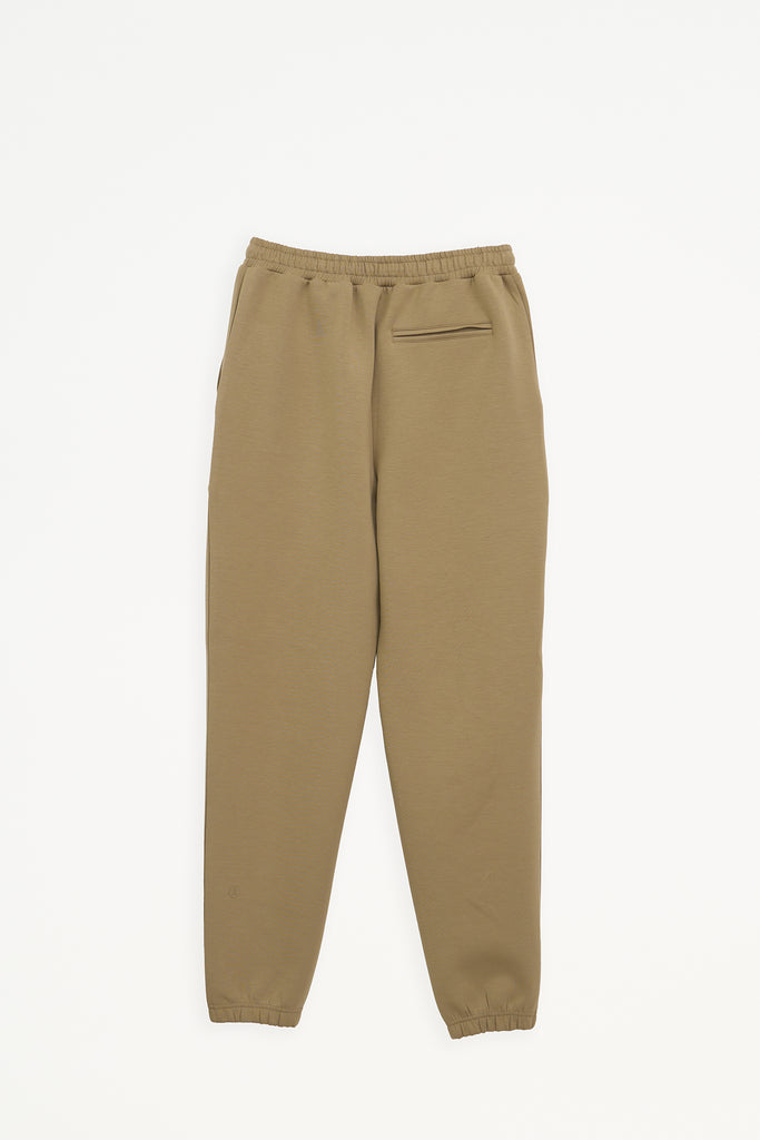 Pantalón jogger confeccionado en tejido interlock de mujer Tantä. Color marrón