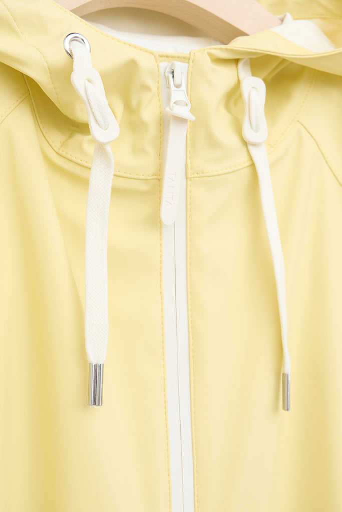 Chaqueta impermeable en poliéster reciclado de mujer SKY Tantä. Color amarillo